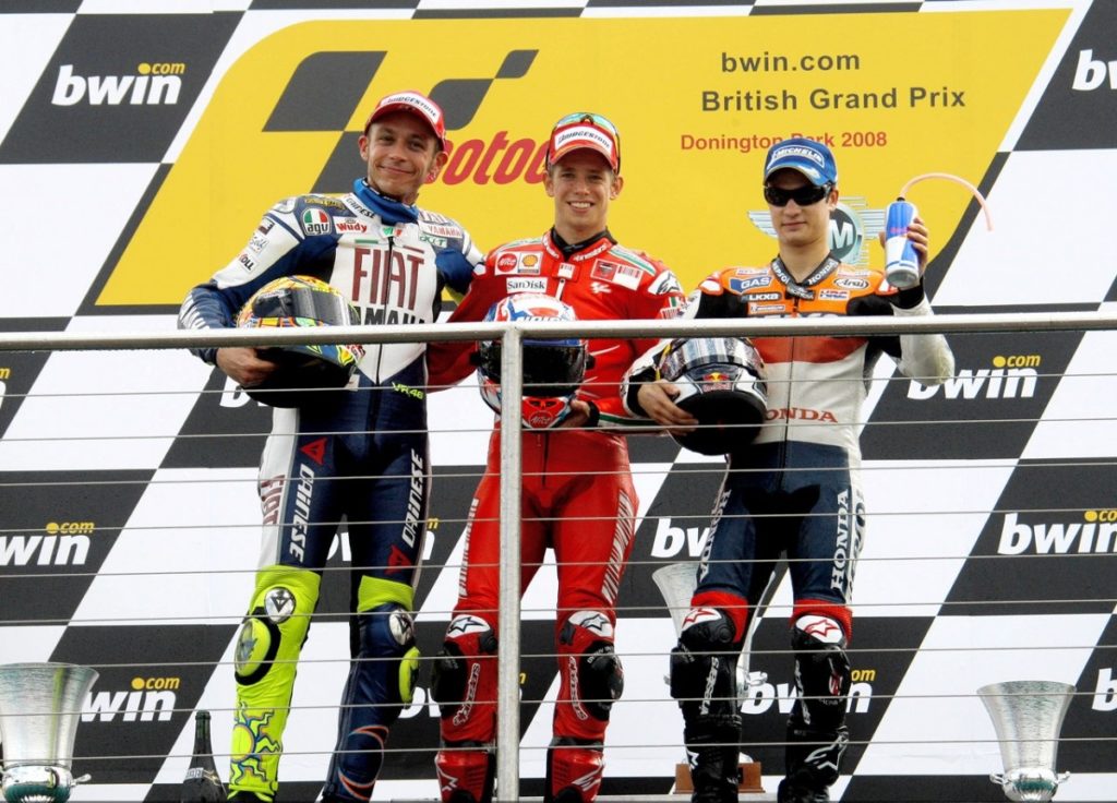 225825_stoner-rossi-and-pedrosa-on-the-podium-at-donington-motogp-1280x960-jun22-jpg